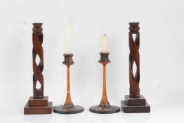 Pair of oak candlesticks with pierced scrolled stems, 30.5cm high, pair of foliate decorated