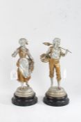 Pair of spelter figures, in the form of harvesters, with gilt and silvered decoration, raised on