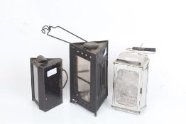 Three collapsible travel candle lanterns to include two triangular and a rectangular example, the