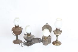 Four wall mountable oil lamps, two with gimballed frames (4)