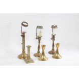 Two brass ejector candlesticks, pair of brass candlesticks with push rod ejectors and attached shade