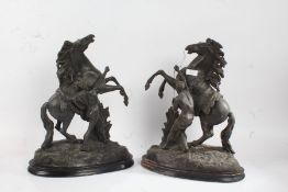 Pair of spelter Marly horses, raised on ebonised plinth bases, 42cm high
