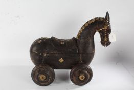 Indian wooden spice horse, with swivelling upper body, decorated small brass roundels and raised