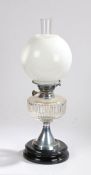 Best British Make oil lamp, with clear glass chimney and white glass globe form shade above a