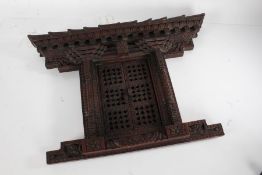 Chinese carved wooden votive frame, of architectural form, 46cm wide