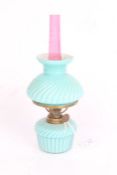 Spar Brenner small oil lamp, the ruby glass chimney above a frosted swirled turquoise shade and