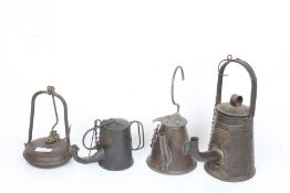 Four miners lamps, to include example by Battye, Braine, McKitrick and an unnamed example