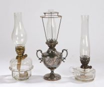 Richard Evered & Sons oil lamp, with clear glass chimney and shade mount above a silver plated