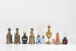 Three French brass lamps, "Pigeon Lampe Merveilleuse", "Lampe Feutree Abeille", "Lampe de Surete",