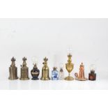 Three French brass lamps, "Pigeon Lampe Merveilleuse", "Lampe Feutree Abeille", "Lampe de Surete",