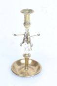 Brass candlestick with central bell above the drip pan, 29.5cm high