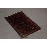 Iranian prayer rug, the red ground with diamond pattern foliate centre surrounded by multiple