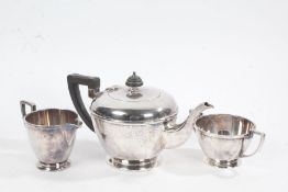 Mappin & Webb silver plated three piece tea set, consisting of teapot, milk jug and twin handled