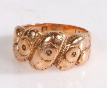 Gold coloured metal ring, with roundel decorated head, ring size F1/2, 3.5g