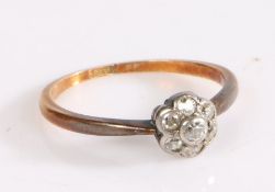 18 carat gold ring, the head set with seven diamonds in a flower head formation, ring size L1/2, 1.