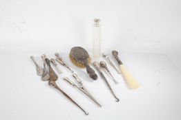 Silver handled dressing table accessories, to include button hooks, hair brush, glove stretcher,