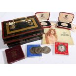 Pobjoy Mint, two cased silver Crowns,1977, together with four £5 coins, a Festival of Britain 1951