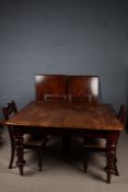 Victorian mahogany extending dining table, the rectangular top with rounded corners raised on