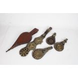 Six horse brasses, mounted on four leather straps, pair of oak and leather bellows (5)