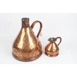 Copper two gallon measure, of tapering baluster form with loop handle, 36cm high, smaller measure,