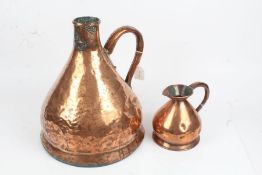 Copper two gallon measure, of tapering baluster form with loop handle, 36cm high, smaller measure,