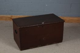 Stained pine blanket box, the hinged lid enclosing a candle box interior, carrying handle either
