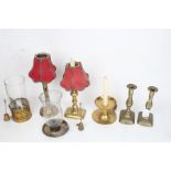 Brass candlesticks, storm lanterns and chamber sticks, to include example with adjustable stem,