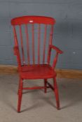 Red painted Windsor chair, with stick back rest and open elbow rest, 104cm high