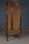 Victorian bamboo cupboard, the single door enclosing two shelves and hanging hooks, 72cm wide x