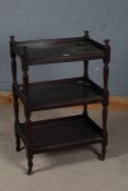 Edwardian three tier mahogany trolley, with beaded edges and tapering columns raised on castors,