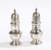 Near pair of George III silver sugar castors, London 1785 and 1787, one maker J.W, the pierced domed