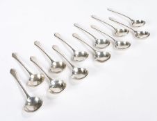 Set of twelve George V silver dessert spoons, Sheffield 1934, maker Mappin & Webb, with round