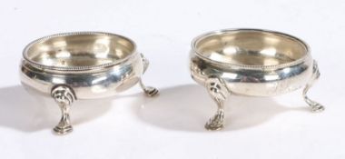 Near pair of George III silver salts, London 1763 and 1767, maker John Muns, of cauldron form,