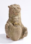 Carved stone lion, the lion with an open mouth clutching a shield, 32cm high