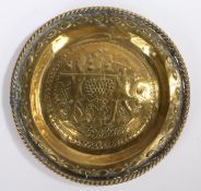 17th century Nuremberg brass alms dish, the central boss depicting Joshua & Caleb; the Spies of