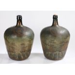 Pair of large polychrome decorated bottles, both painted with Dutch Naval scenes, the first with the