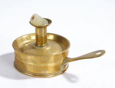 19th Century brass chamber stick, the candle holder above the removable top and shaped handle,