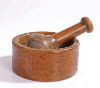 19th Century turned fruitwood pestle and mortar, the pestle 17.5cm high, the mortar 18cm wide, (2)