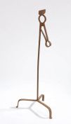 Iron rush light holder, with a sprung top above the stem and three arched supports, 72cm high