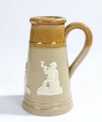 19th Century stoneware shaving mug, with figural scenes to the tapered body,  16.5cm high