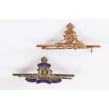 Pre 1952 Royal Artillery badge in yellow metal on a 9ct gold bar with pin fitting, together with a