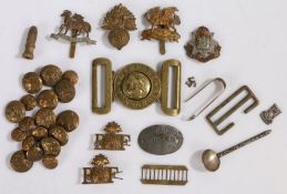 Collection of British army cap badges, shoulder titles and buttons to the Royal Fusiliers, Buffs,
