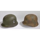 Two Movie prop/reenactor Second World War German combat helmets, one in 'Normandy' camouflage, the