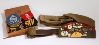 Selection of militaria including two Russian side caps, one with a quantity of cold war period