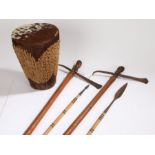 Ornamental African weaponry, two ceremonial spears, two axes, together with a cowhide drum, (5)