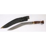 Decorative Kukri, wooden handle with brass bolster, held in leather covered wooden scabbard with