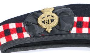 Glengarry bonnet with diced band, bearing reproduction badge to the 61st (South Gloucestershire)