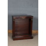Egyptian revival mahogany bookcase, the rectangular top above pillars in the form of Egyptian