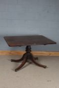 Victorian mahogany rectangular tilt top breakfast table, with a turned central column with four