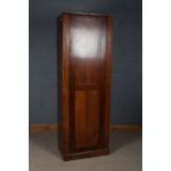 Victorian mahogany single door cupboard, of narrow proportions, with a shelved interior, 204cm tall,